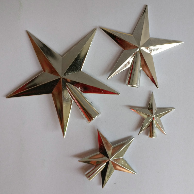 Set of metallic star-shaped objects on a white background