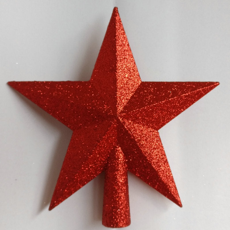 Red glittery star-shaped object on a white background
