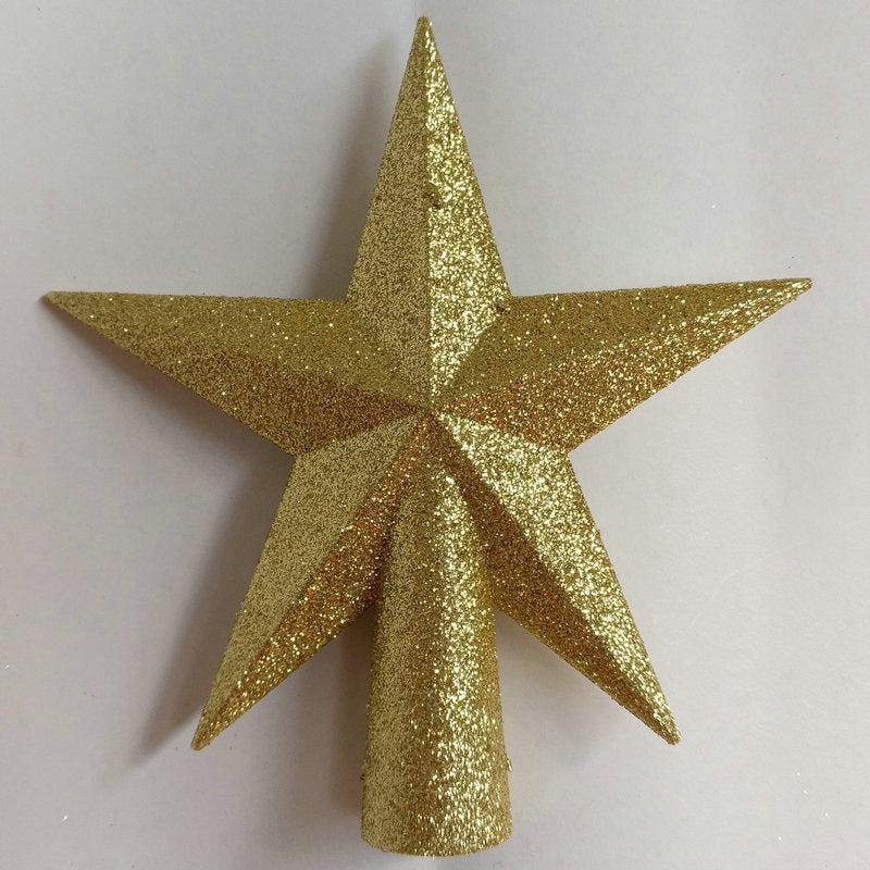 Gold glittery star-shaped object on a white background
