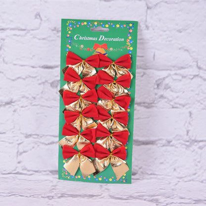 Packaged Christmas decorations with red and gold bows on a textured white background