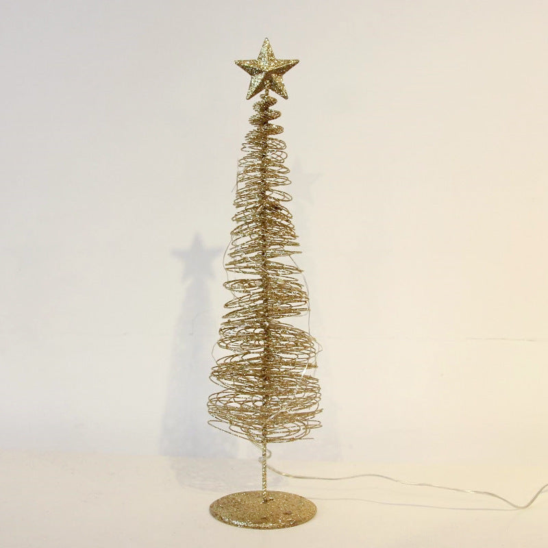 Gold spiral Christmas tree with a star on top against a white background