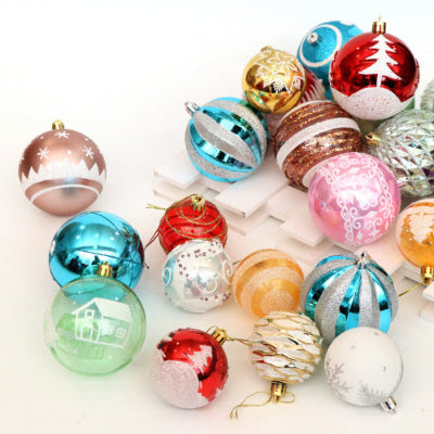 Assorted colorful Christmas ornaments on a white background