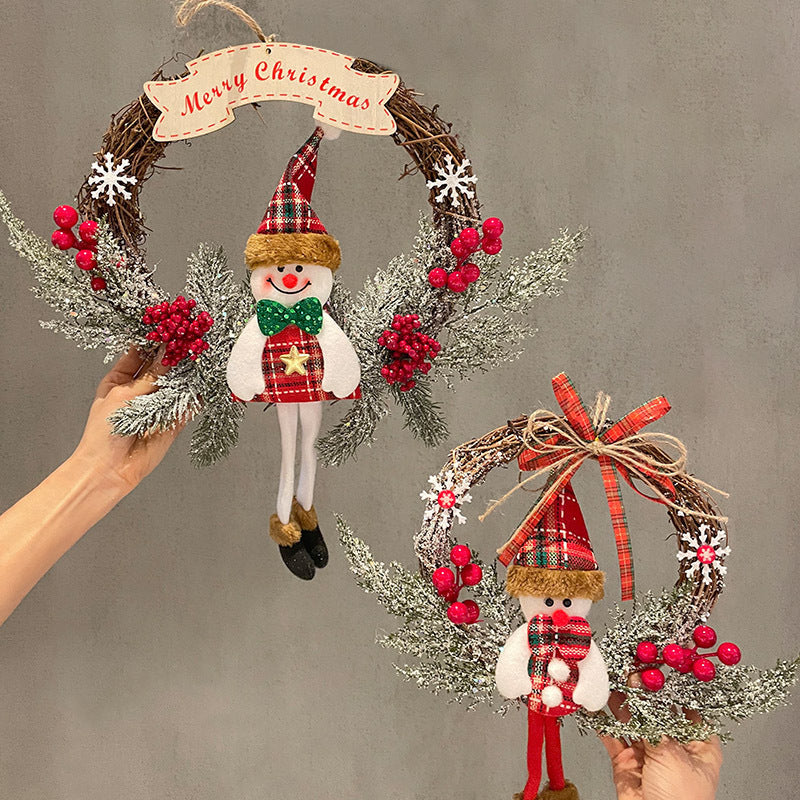 Two Christmas-themed wreaths with snowmen and festive decorations on a gray background.