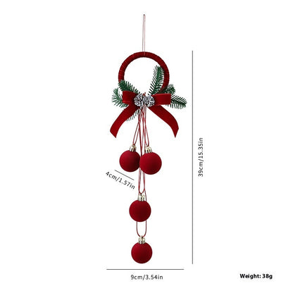 Red Christmas ornament with bow and balls on a white background