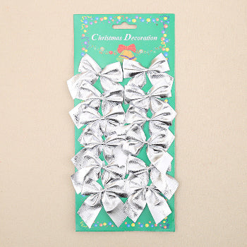 Pack of silver bows on a green card with 'Christmas Decoration' text.