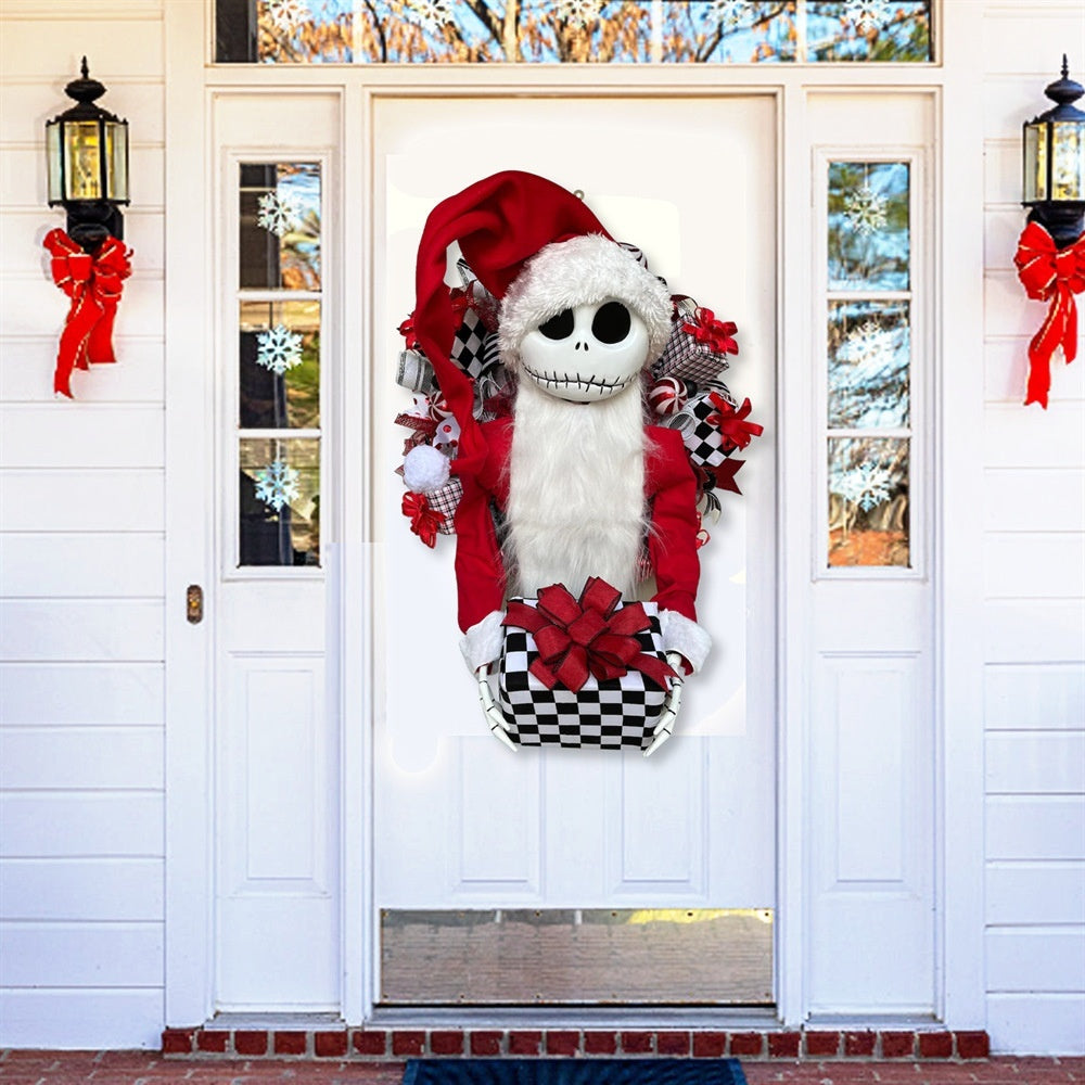 Decorative door hanger with a skeleton in a Santa outfit on a white door.