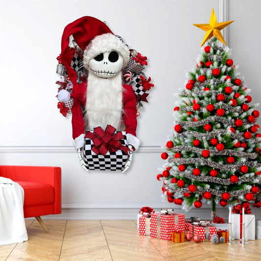 Decorative plush character in a Santa outfit next to a Christmas tree with red ornaments and presents.