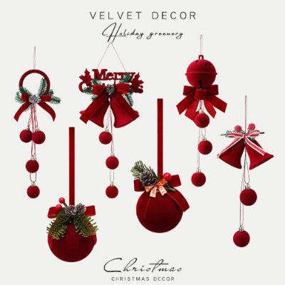 Collection of red velvet Christmas decorations with bows and greenery on a white background.