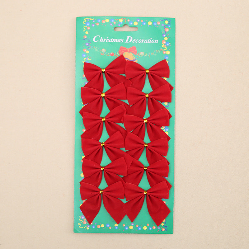 Pack of red Christmas bows on a green card with 'Christmas Decoration' text.