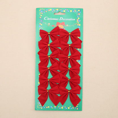 Pack of red Christmas bows on a green card with 'Christmas Decoration' text.
