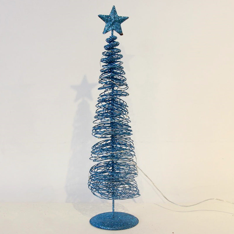 Blue glittery Christmas tree with a star on top against a white background